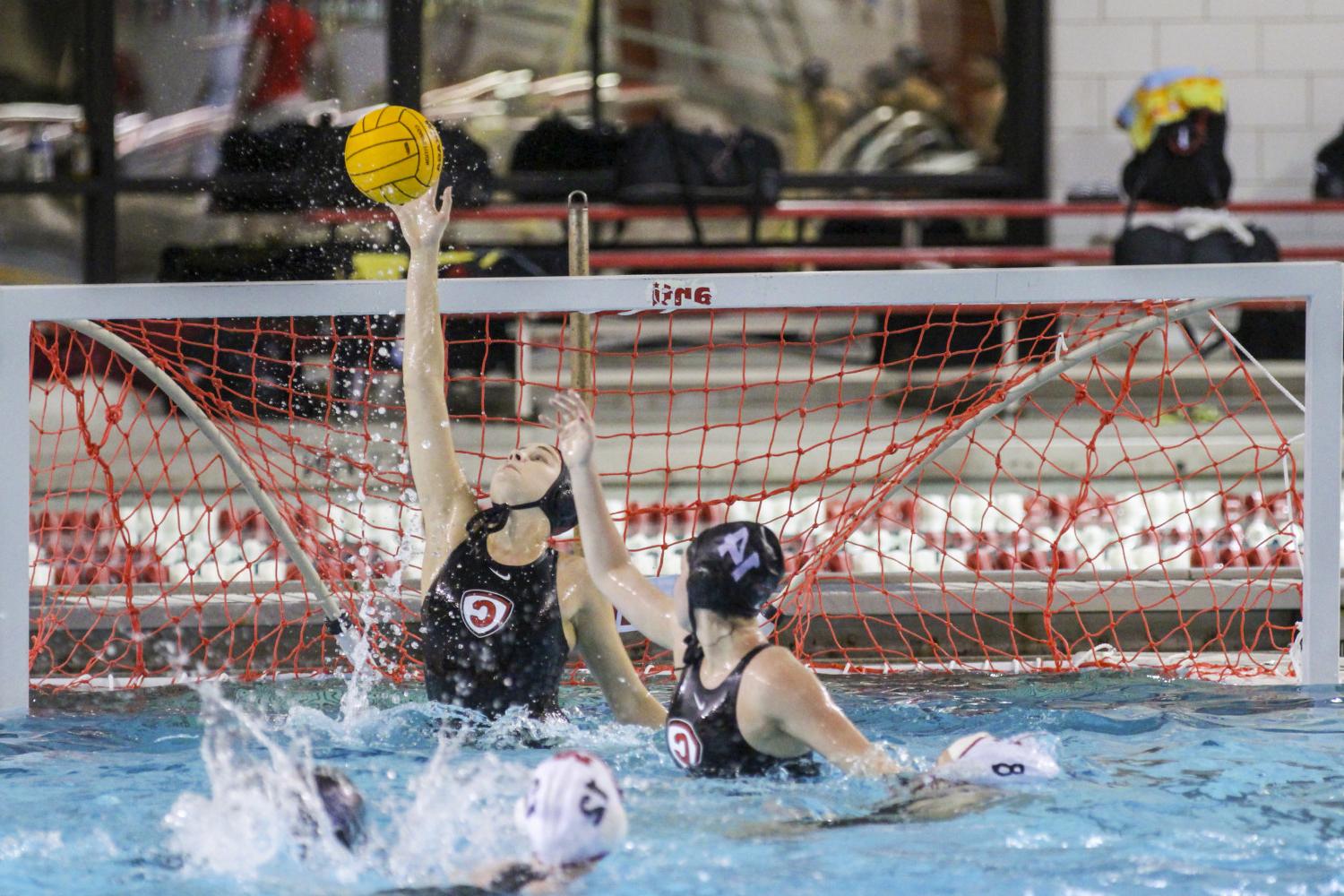 Carthage College student athletes compete in a water polo tournament on campus.